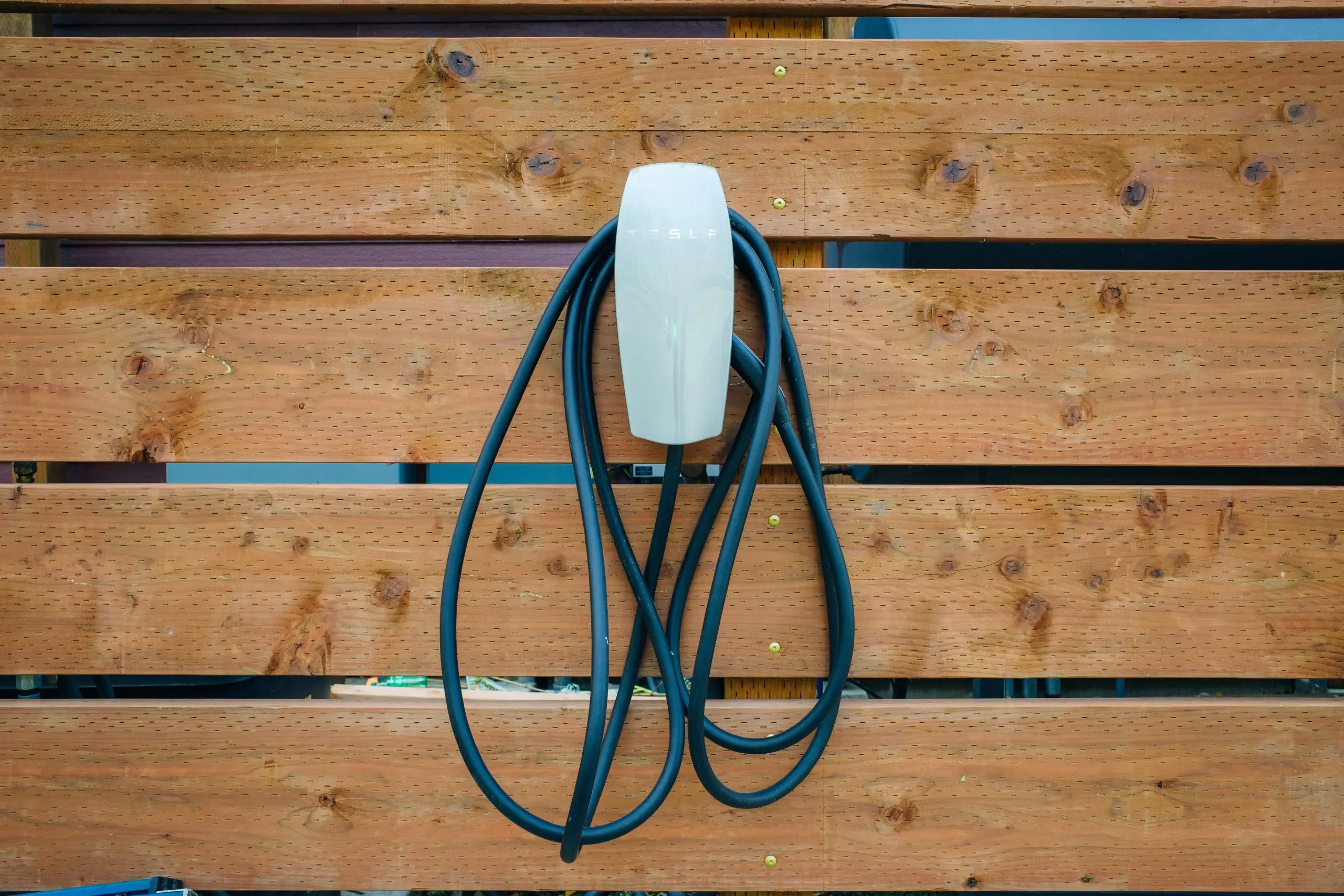 EV Charger installed at the wall Electric vehicle charger installed at home