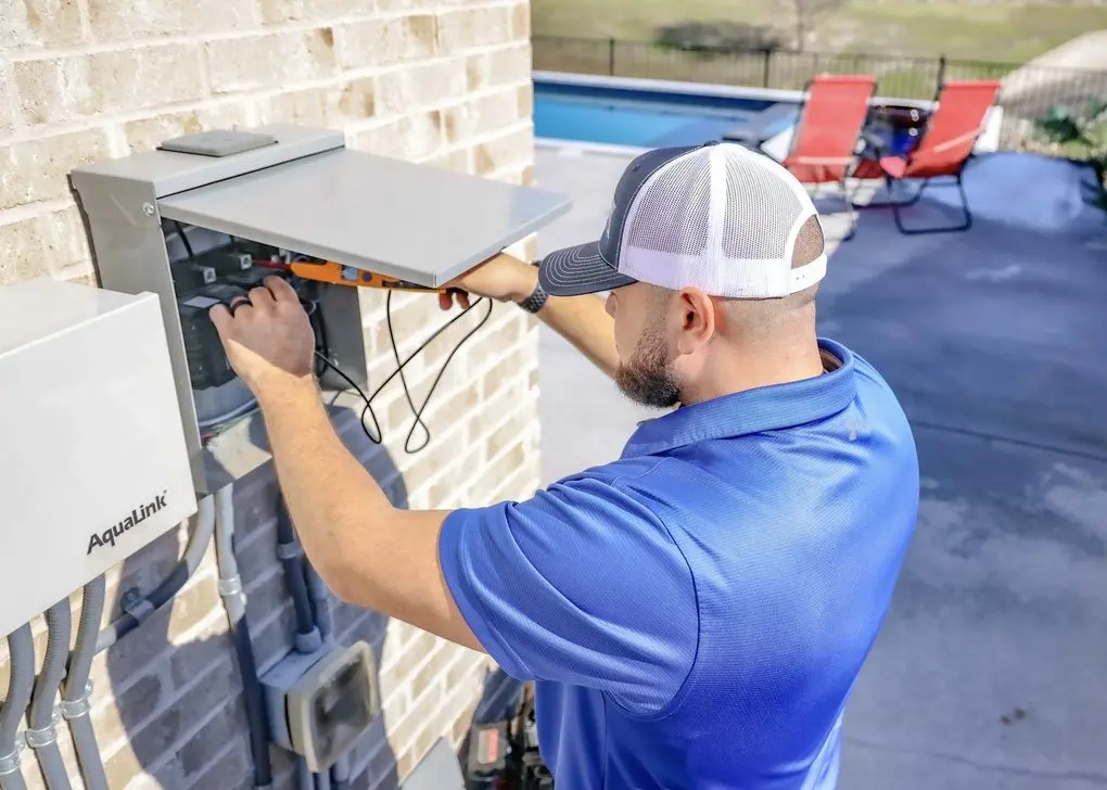 Electrical Panel Installation Electrician installing an electrical panel in a home
