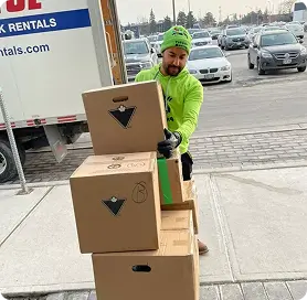Man loading Canadian Tire boxes from a truck Takeoff-Moving Toronto