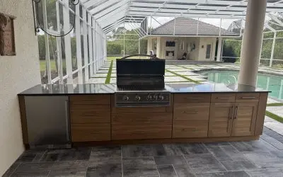 Home Improvement Featuring an Outdoor Kitchen in Melbourne, FL, With Custom Cabinets, a Countertop, and a Built-In Grill