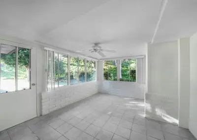 Canva Bright Sunroom With Large Windows And Ceiling Fan Mag5fbtevba
