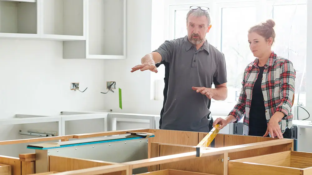 Man And Woman Remodeling Home Man And Woman Remodeling Home