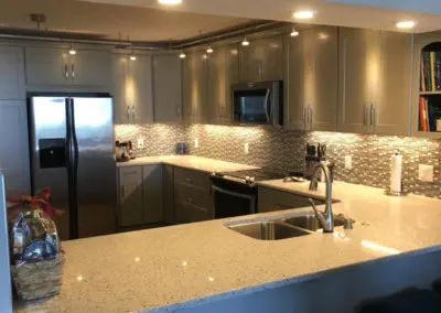 kitchen cabinets and countertop with backsplash