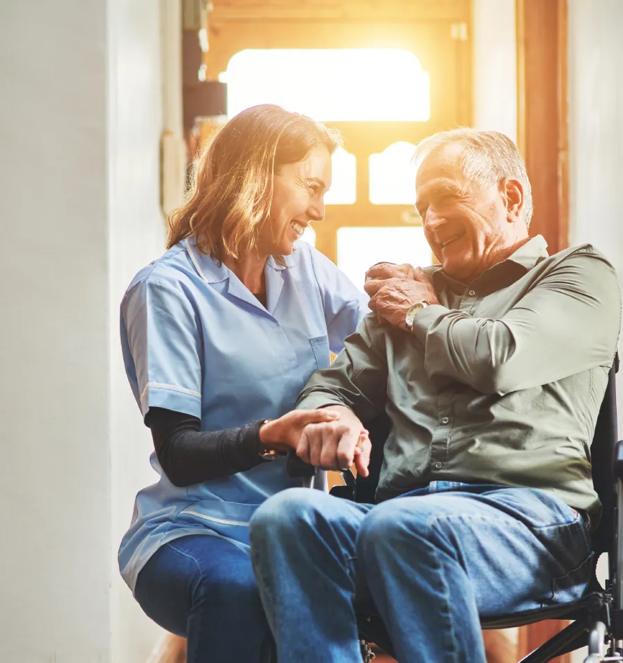 caregiver helping resident with daily care