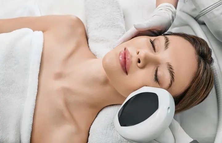 a women getting IPL laser on her face