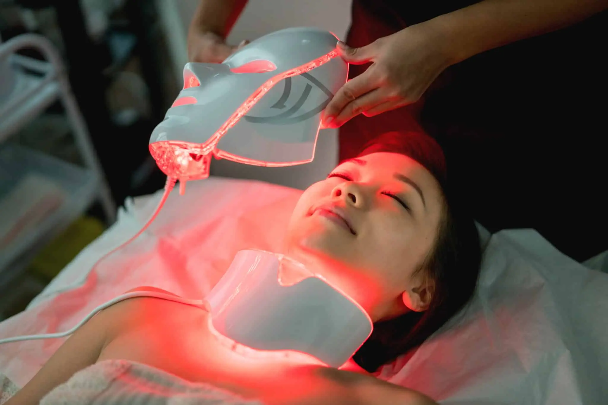 Beautiful woman at the spa getting a facial laser treatment - beauty concepts