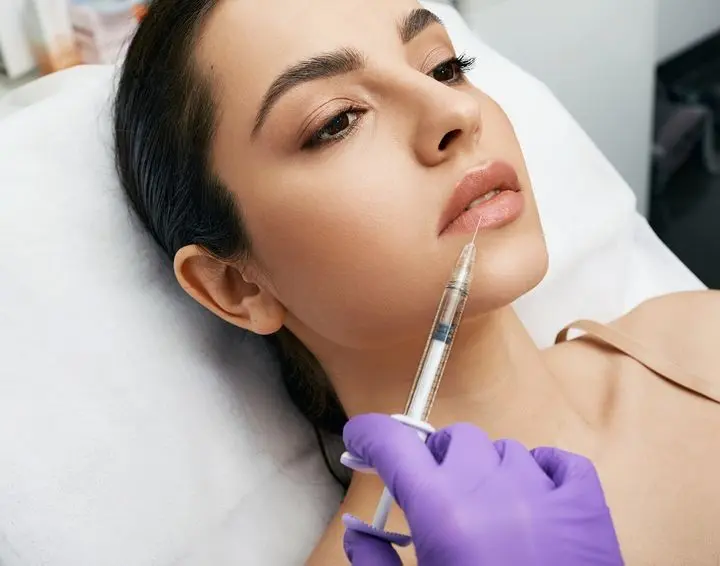 woman getting lip filler treatment