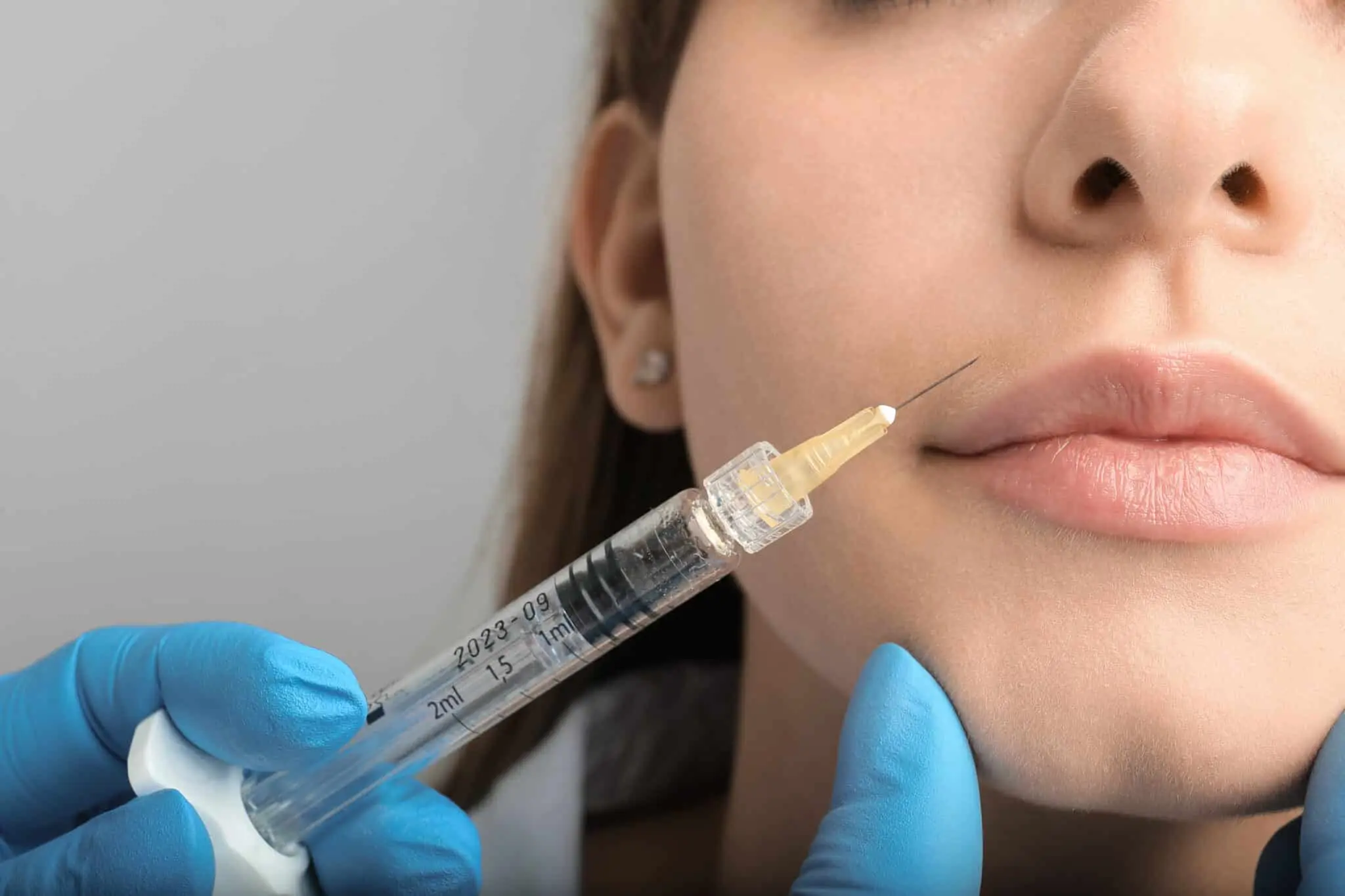 woman getting a facial injection