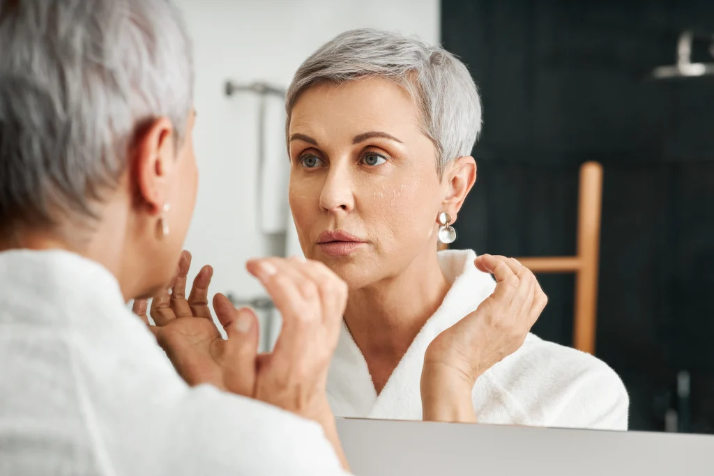 LIfestyle 50 older white woman mirror lifestyle clinical menopause