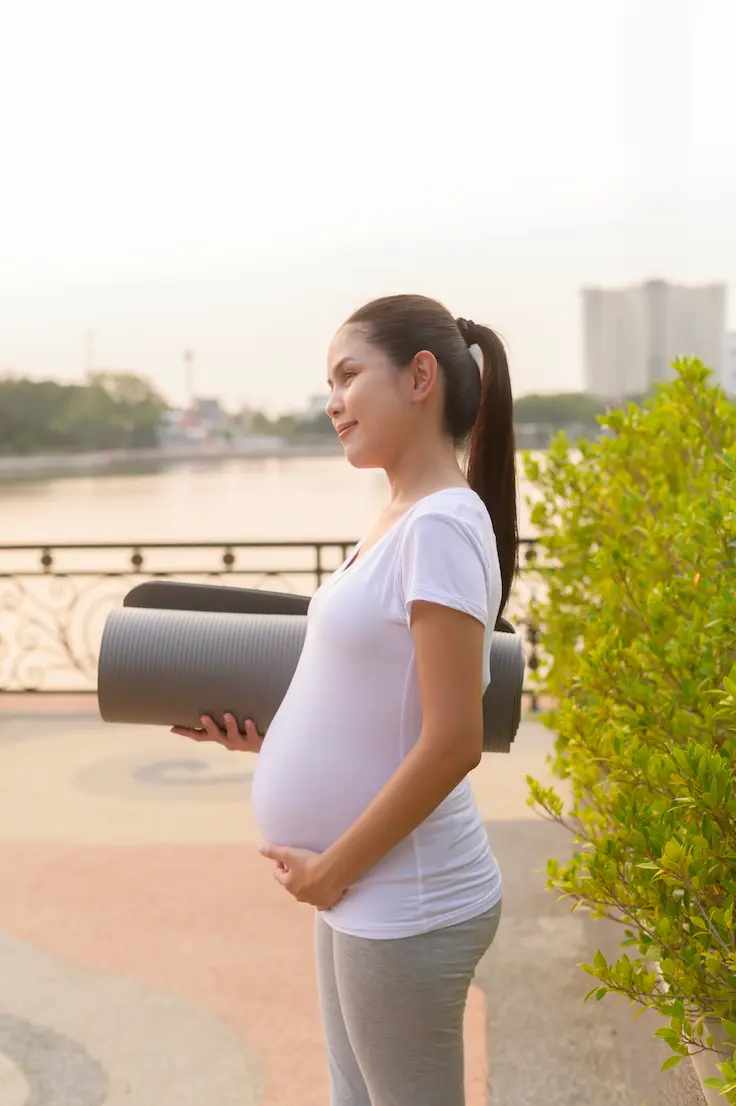 Physical Therapy 3 pregnant-woman-with-yoga-mat-outdoors-2026