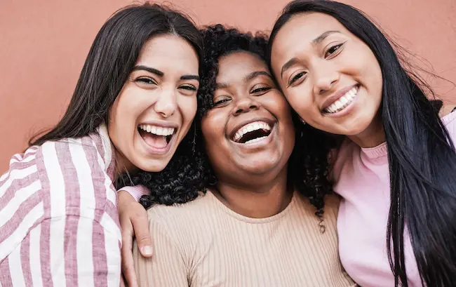 Birth Control 1 three smiling young women posing closely together 2026 09 23 22 48 59 utc