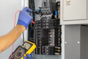 Electrician testing an electrical box