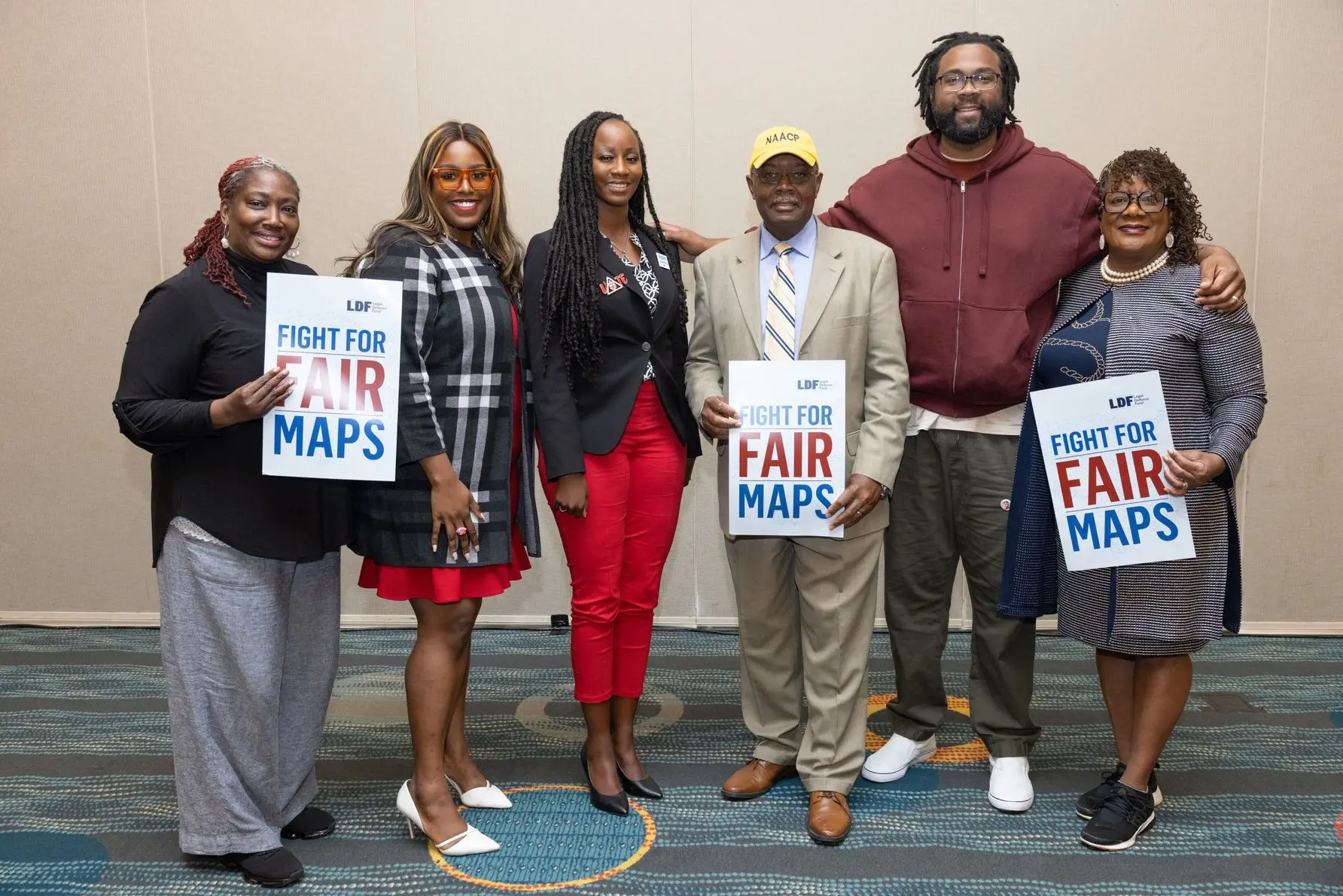 Plaintiffs in Allen v. Milligan stand together after a press conference following arguments in the case. Photo by Allison Shelley for LDF.