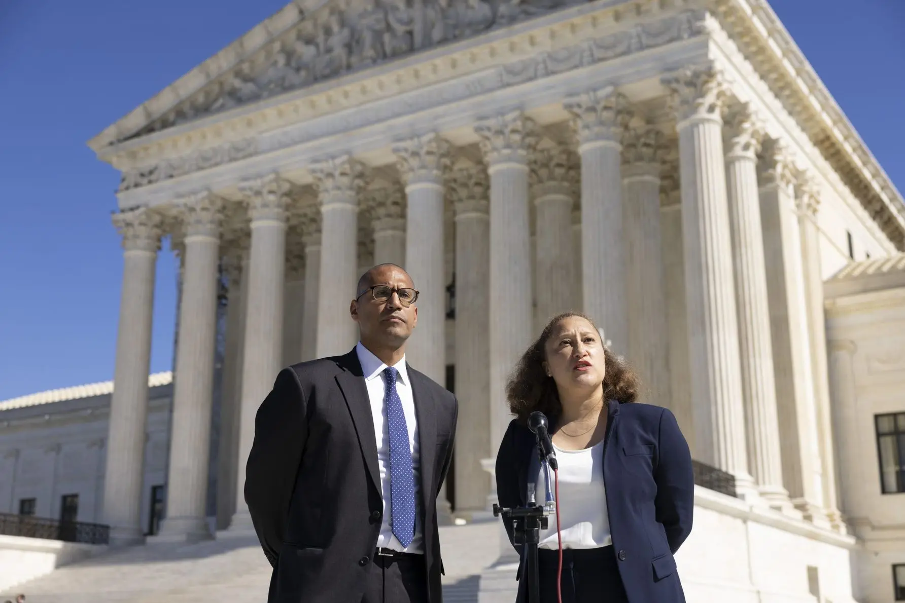 Leah Aden stands with ACLU co-counsel in Alexnader v. South Carolina State Conference of the NAACP. They both delivered remarks to the press following the conclusion of the argument.