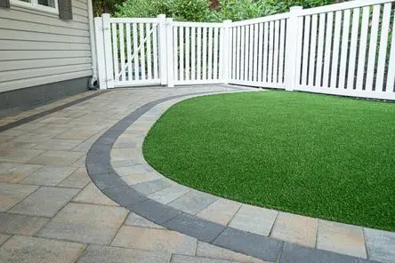 Artificial turf installed beside a concrete patio