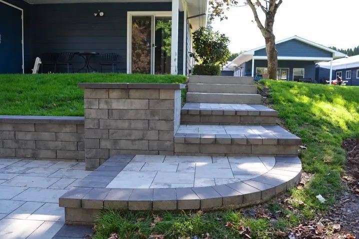 Paver steps connecting the new patio to the existing sidewalk