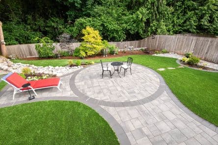Newly installed artificial turf in a residential backyard