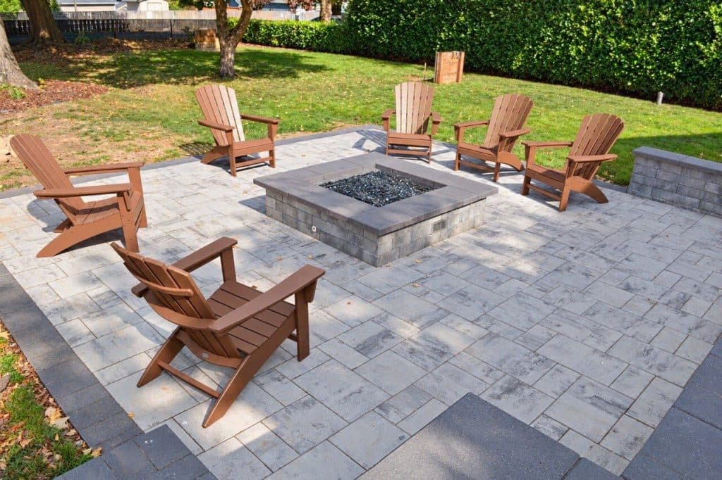 Completed gathering patio with seating around a gas fire pit in Portland, Oregon