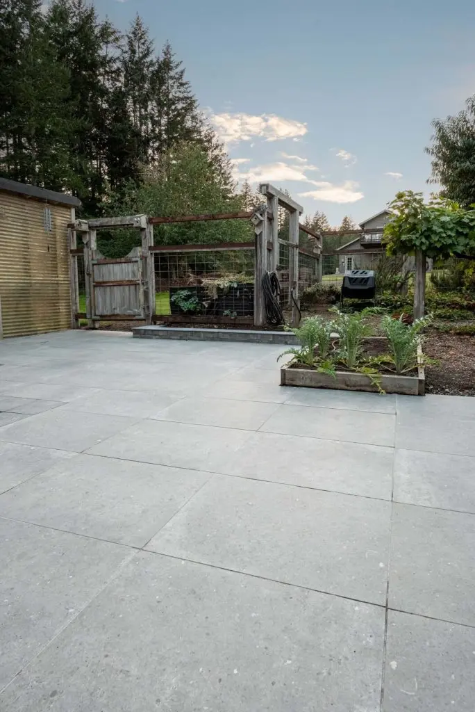 High quality porcelain tile installation on a wide outdoor entertainment area scaled