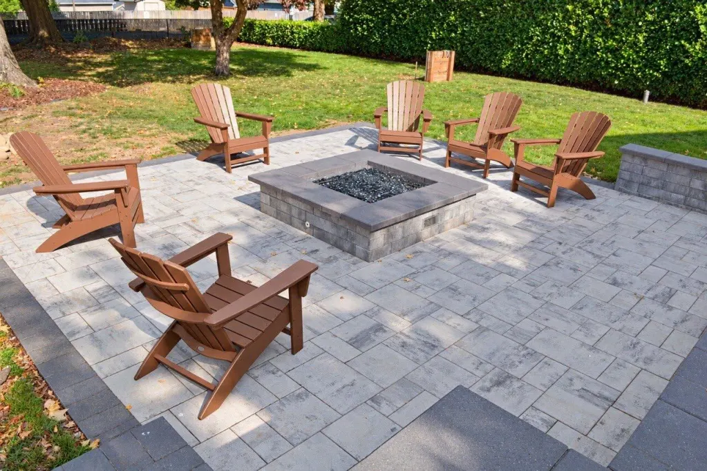 Completed gathering patio with seating around a gas fire pit in Portland, Oregon
