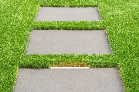 Artificial turf lawn with clean edges and precise cuts