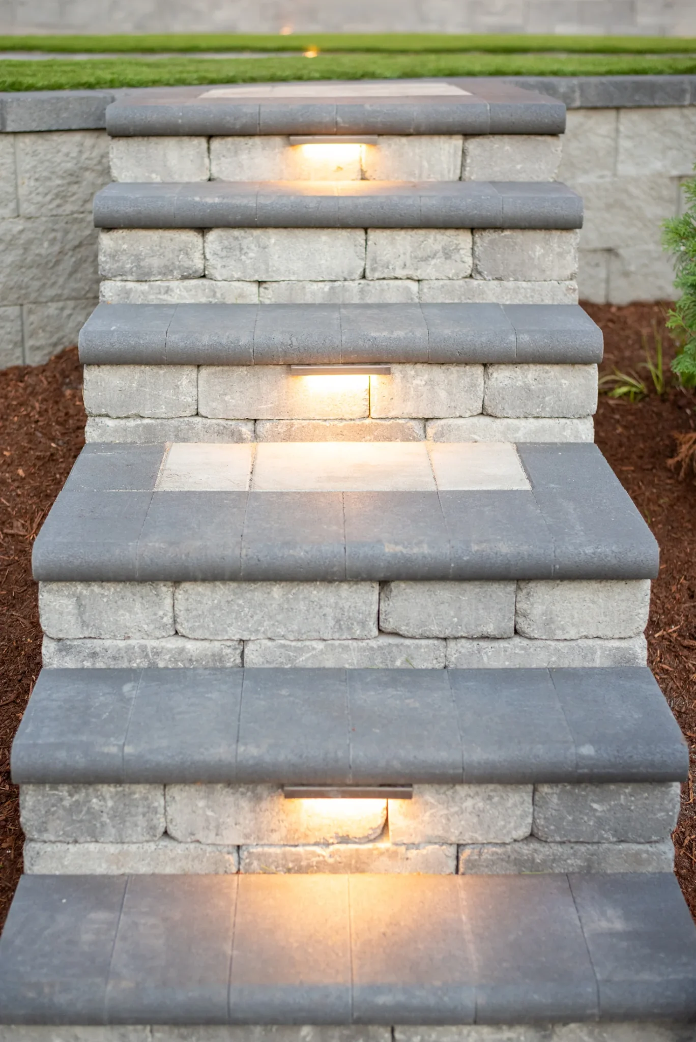 Curved paver patio and landscaped backyard in Kirkland, Washington