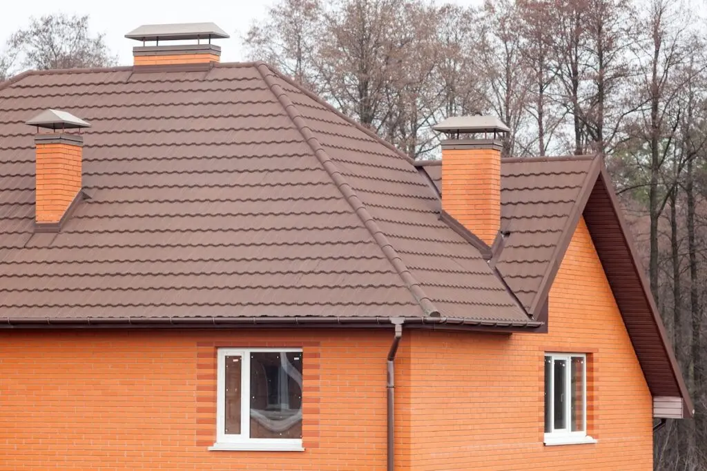 New brick house with modular chimney, Stone Coated Metal Roof