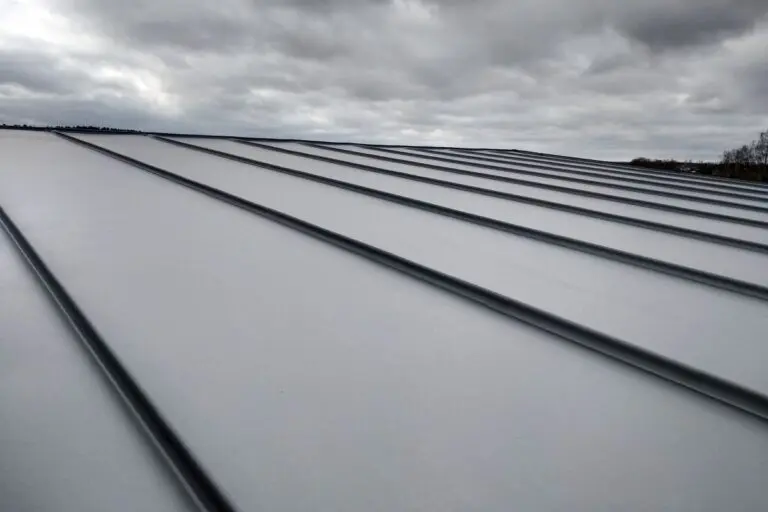 Close-up detail of house roof made from gray metal sheets