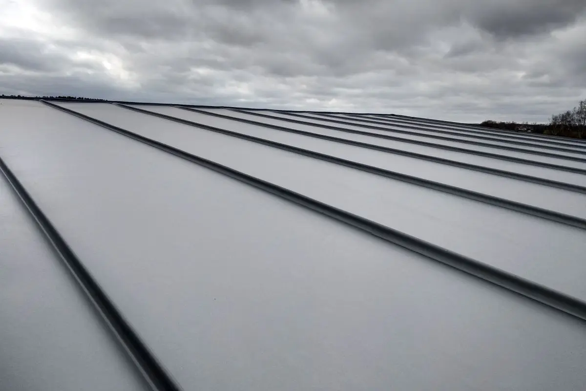 Close-up detail of house roof made from gray metal sheets