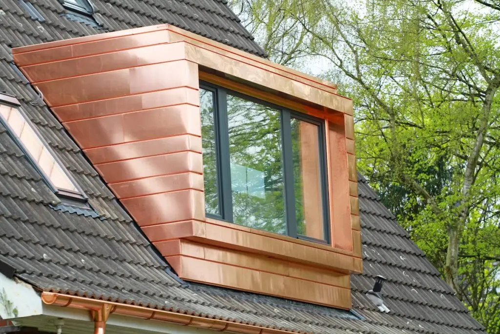 Copper accent roof system installed around window