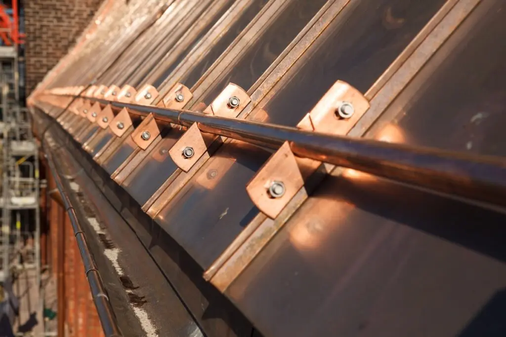 Restoration of old copper roof on business