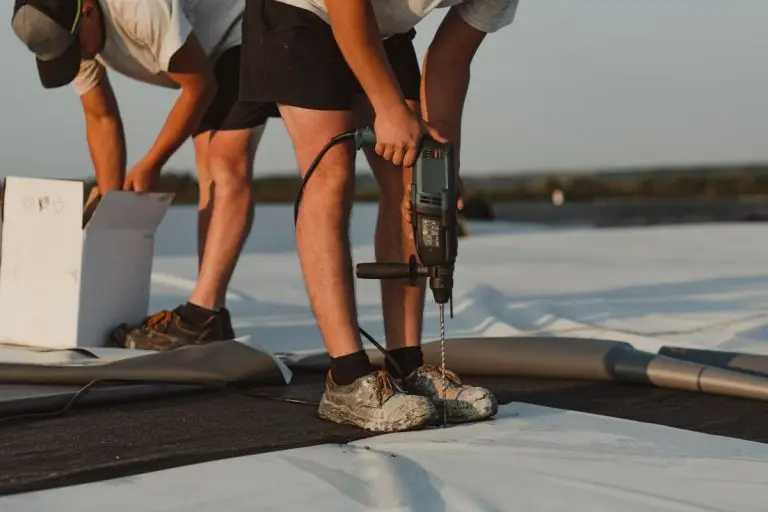 guy installing tpo membrane
