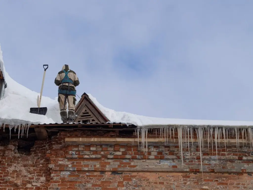 guy removing snow