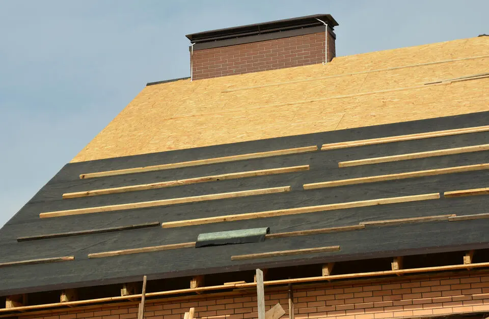 roof sheathing-exposed roof decking on a brick house