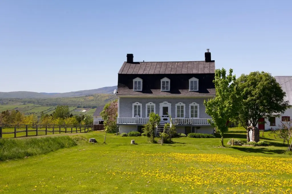 beautiful home with mansard roof