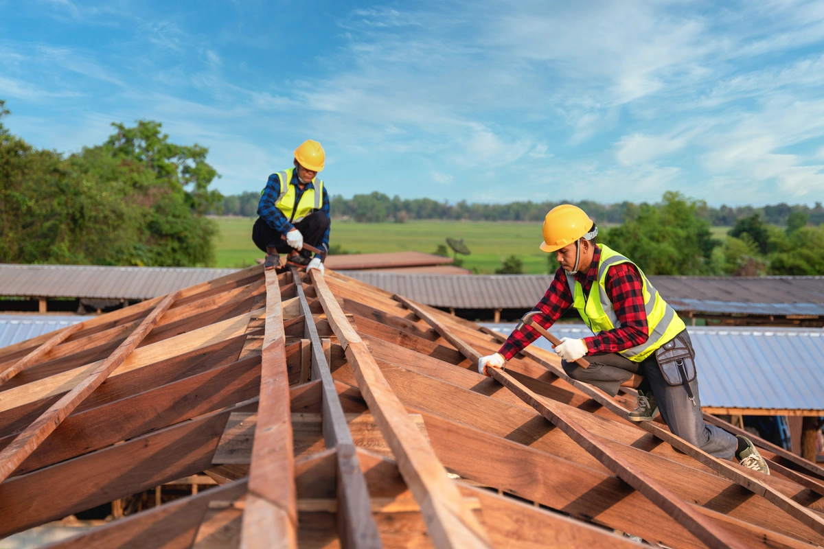 workers on the building roof wearing safety gears