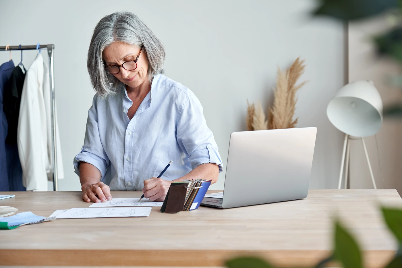 business owner in indiana fills out paperwork at desk