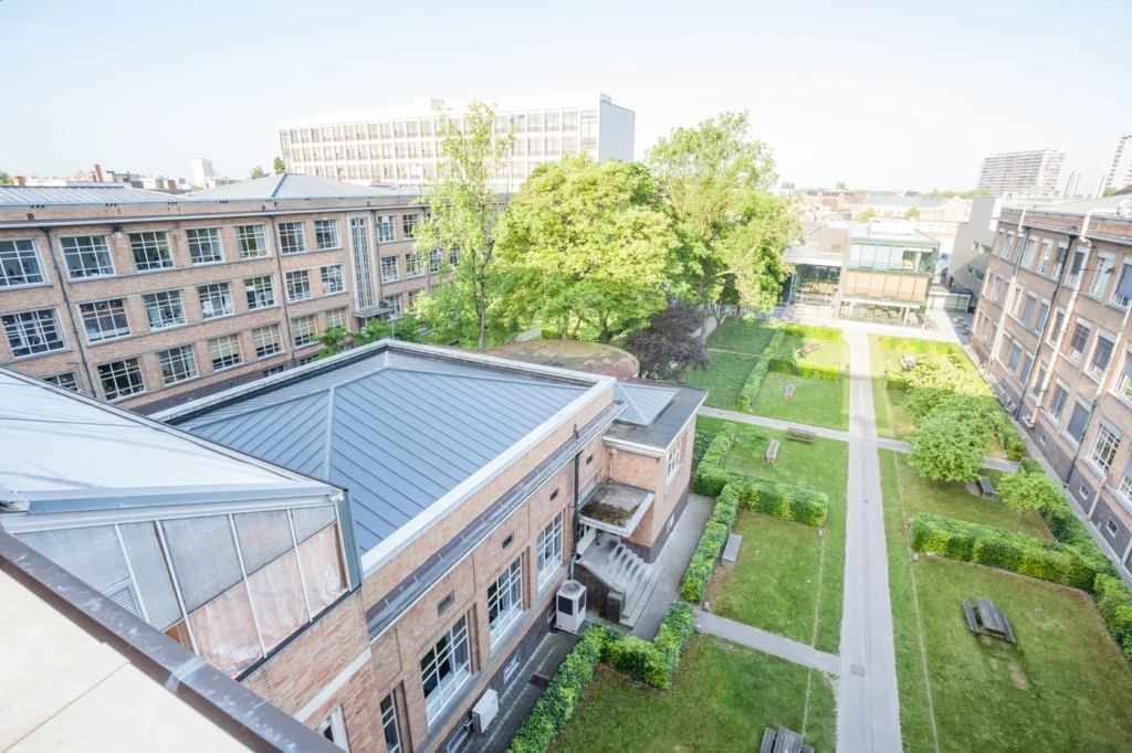 aerial view of storm damage roof repairs on pristine new roof