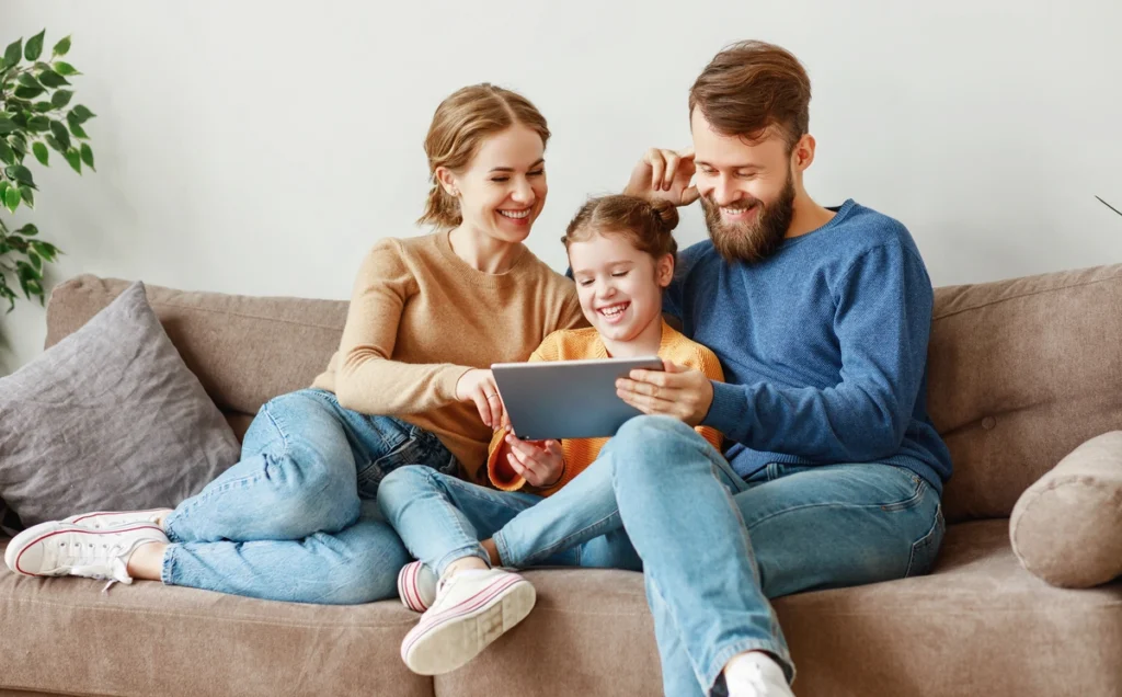 family sitting on couch together