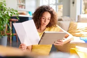 a picture of someone carefully reviewing divorce mediation documents