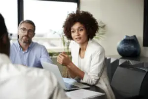 Woman at desk mediating divorce with open mind