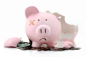 Broken piggybank representing money lost in divorce
