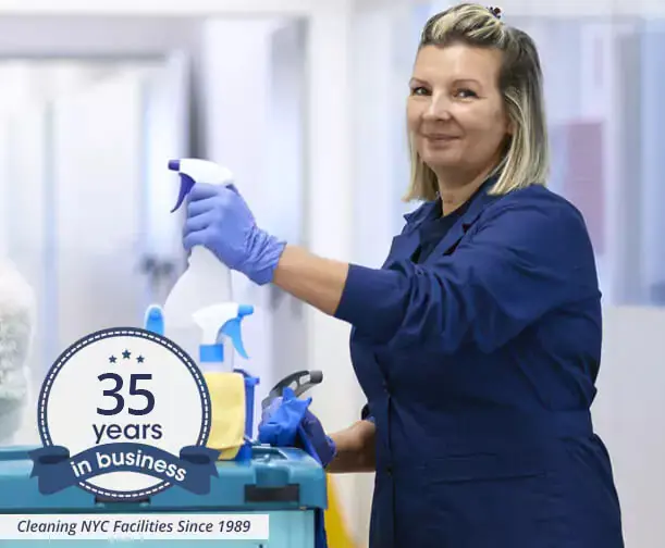 commercial cleaning lady in NYC showing janitorial supplies