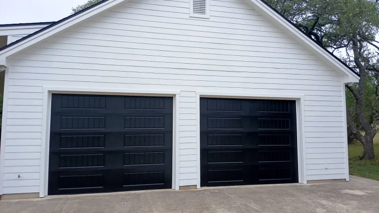 two black panelled garage doors