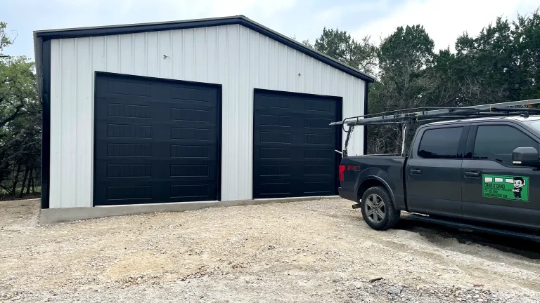two black panelled garage doors