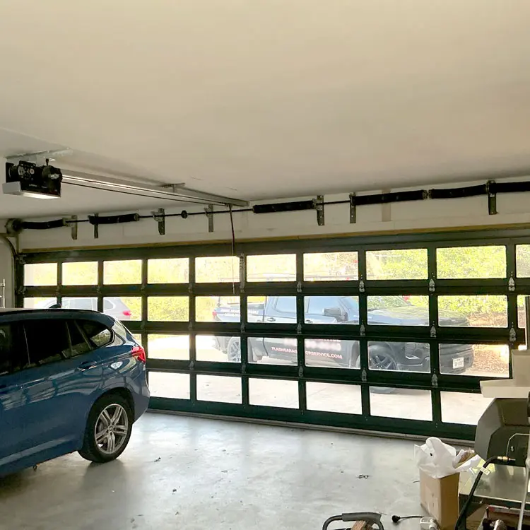 Custom spring system installed on a full-view residential garage door in Austin, TX