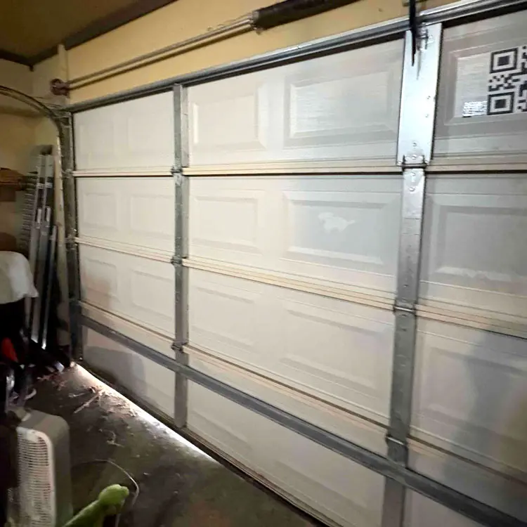 Residential garage door receiving tune-up and preventive maintenance in Tulsa, OK