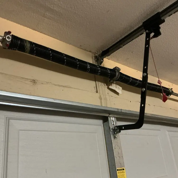 Double torsion spring system replaced on a residential garage door in San Antonio, TX