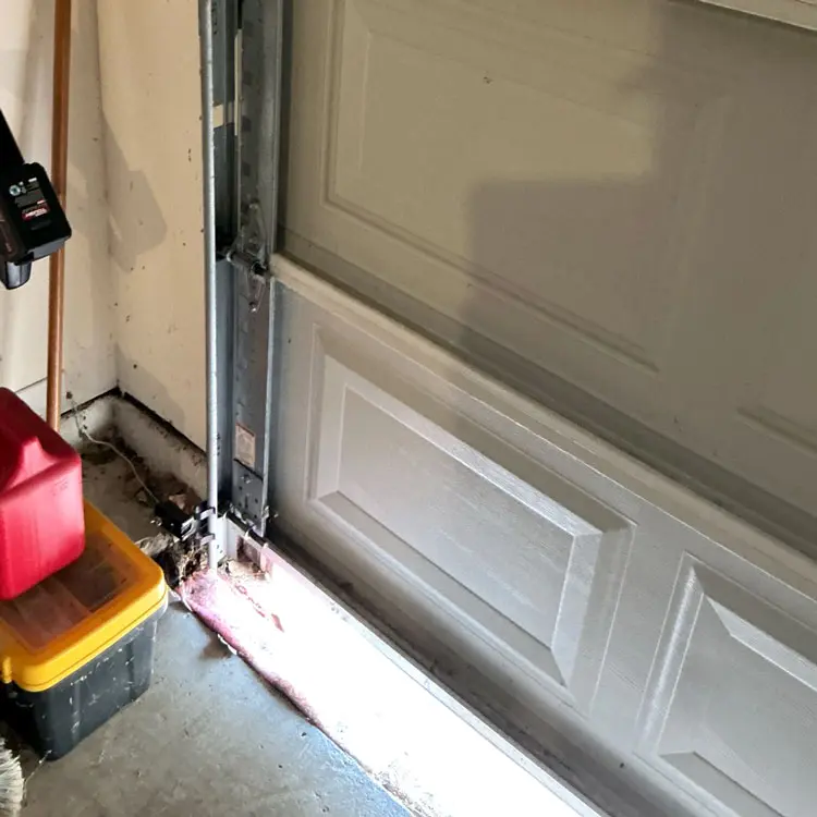 Garage door bottom seal replaced after pulling away from the door at a San Antonio, TX home