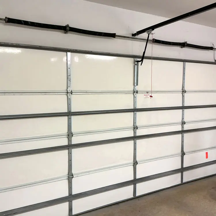 Completed four-spring torsion replacement on a residential garage door in Dallas, TX.